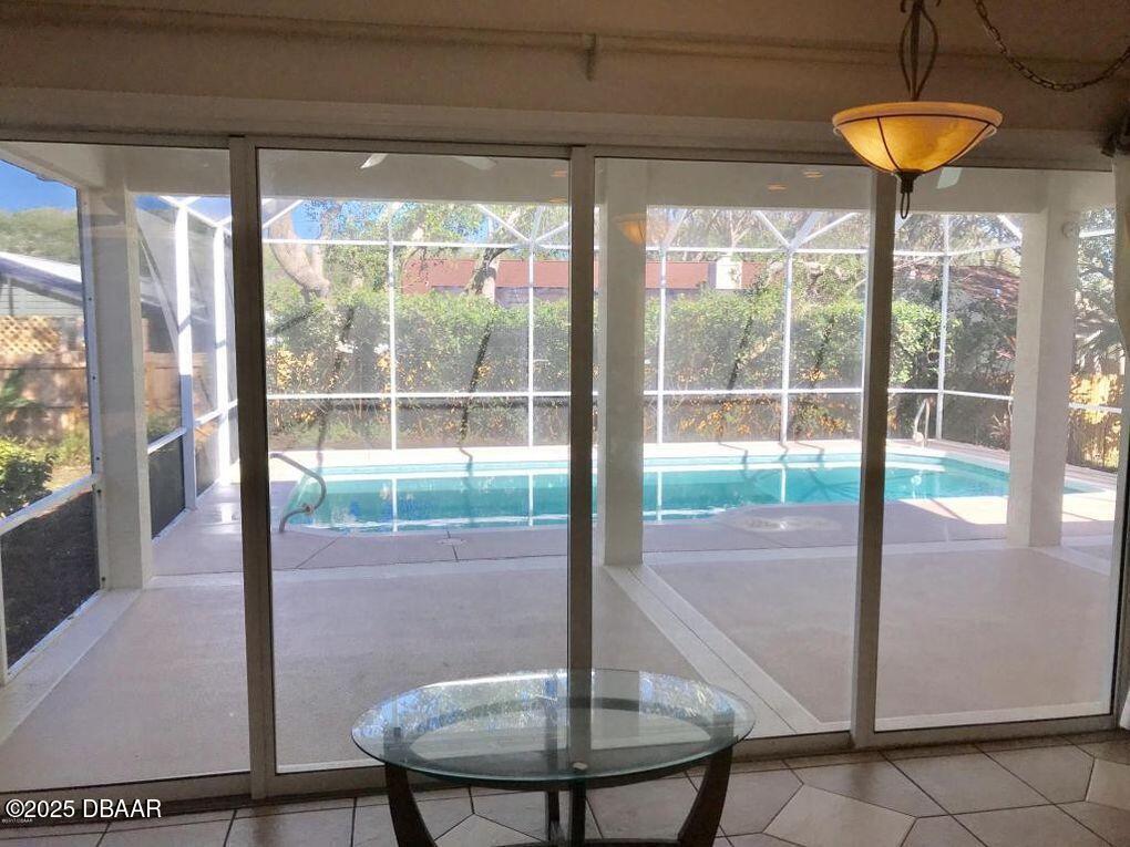 90 Buschman Drive Ponce Inlet, FL 32127 - Photo 15 of 37 a view of a living room and chandelier
