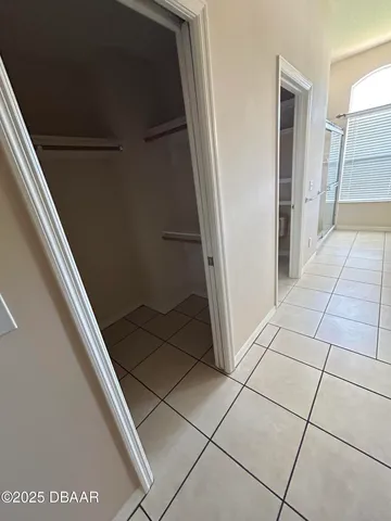 a spacious bathroom with a mirror and a shower