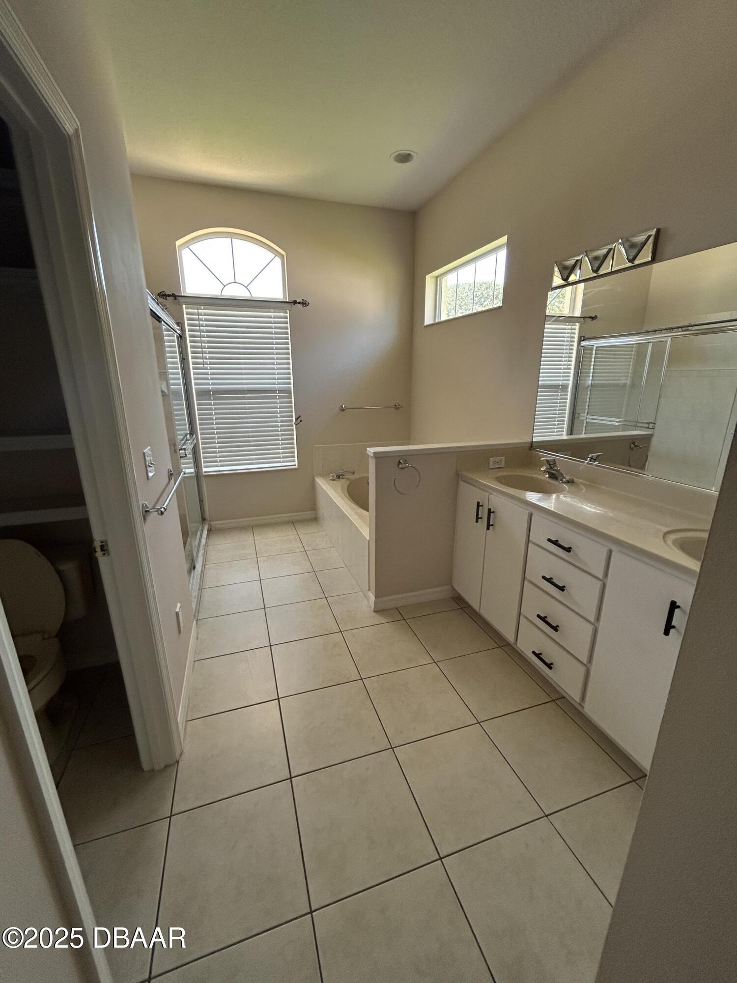 90 Buschman Drive Ponce Inlet, FL 32127 - Photo 20 of 37 a view of a kitchen with storage and utility