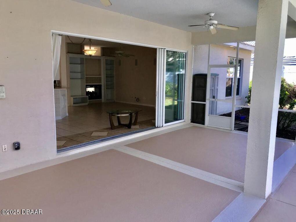 90 Buschman Drive Ponce Inlet, FL 32127 - Photo 21 of 37 a open kitchen with refrigerator and window