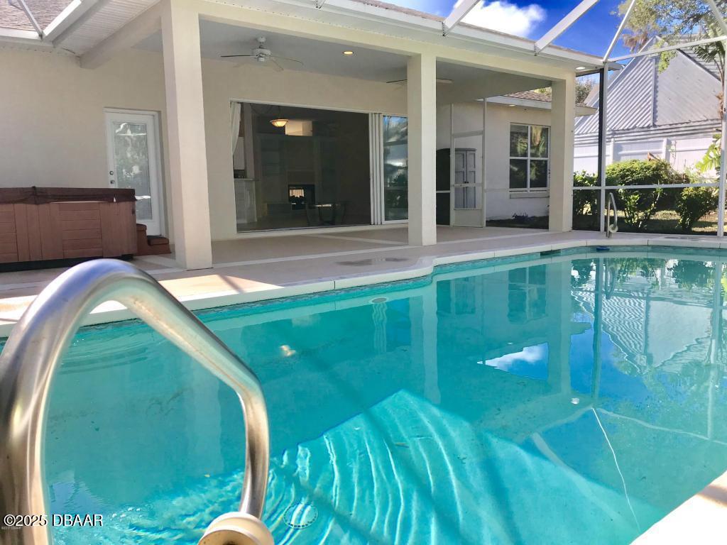 90 Buschman Drive Ponce Inlet, FL 32127 - Photo 23 of 37 a view of a swimming pool with an outdoor seating