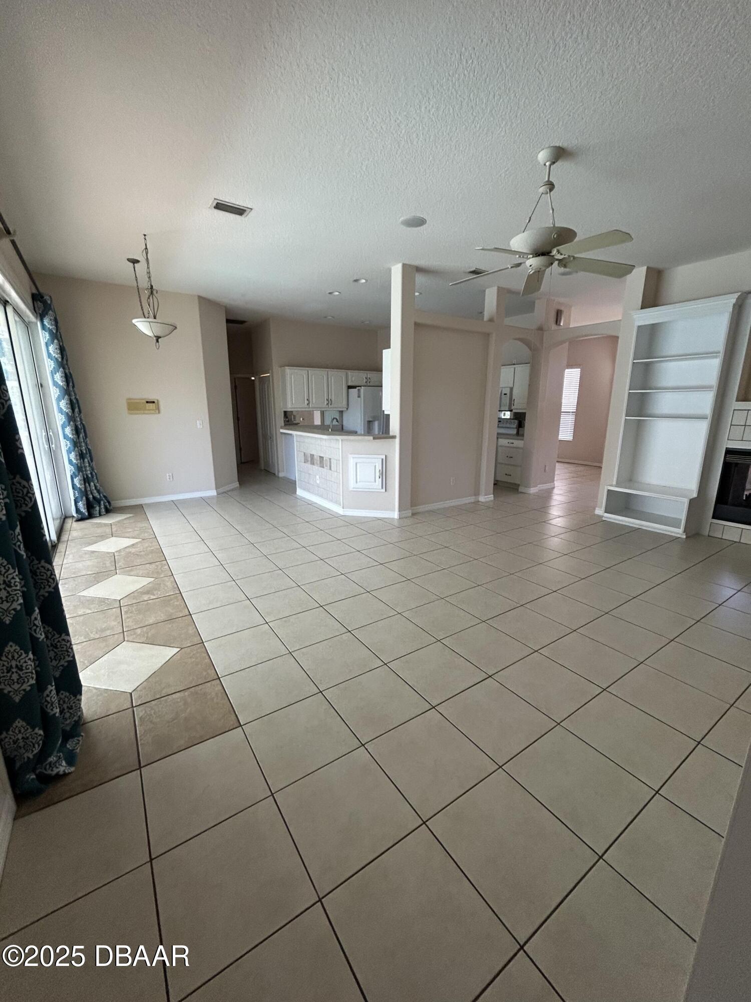 90 Buschman Drive Ponce Inlet, FL 32127 - Photo 24 of 37 a view of a hallway with wooden floor and furniture