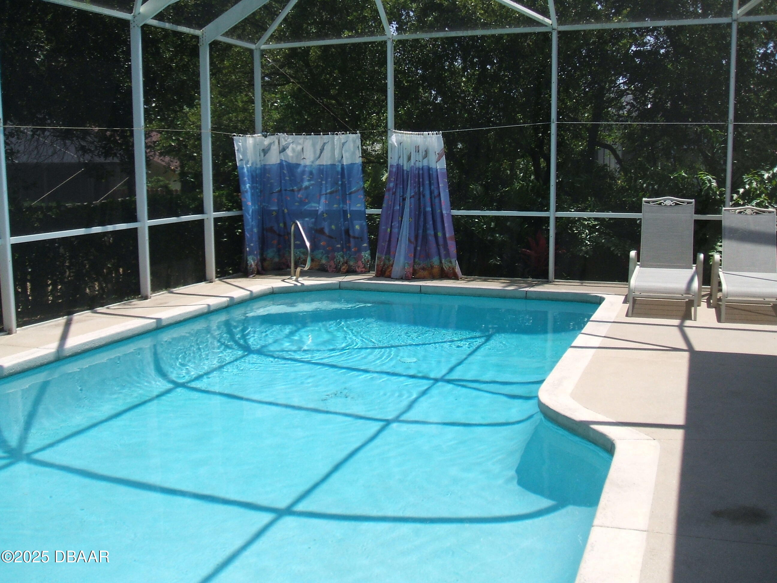 90 Buschman Drive Ponce Inlet, FL 32127 - Photo 25 of 37 a view of a room with wooden floor and a chair