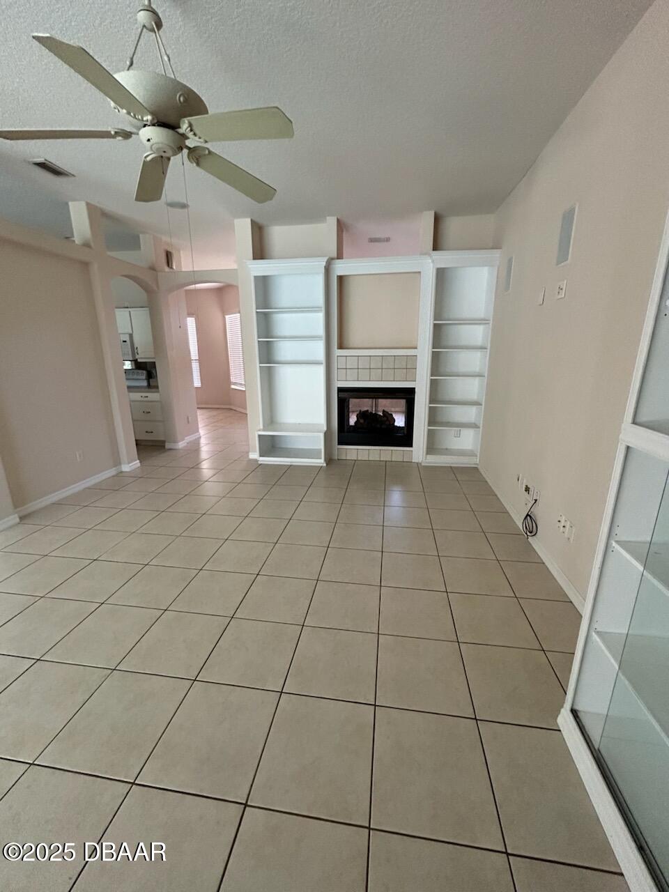 90 Buschman Drive Ponce Inlet, FL 32127 - Photo 26 of 37 a view of a livingroom with a fireplace