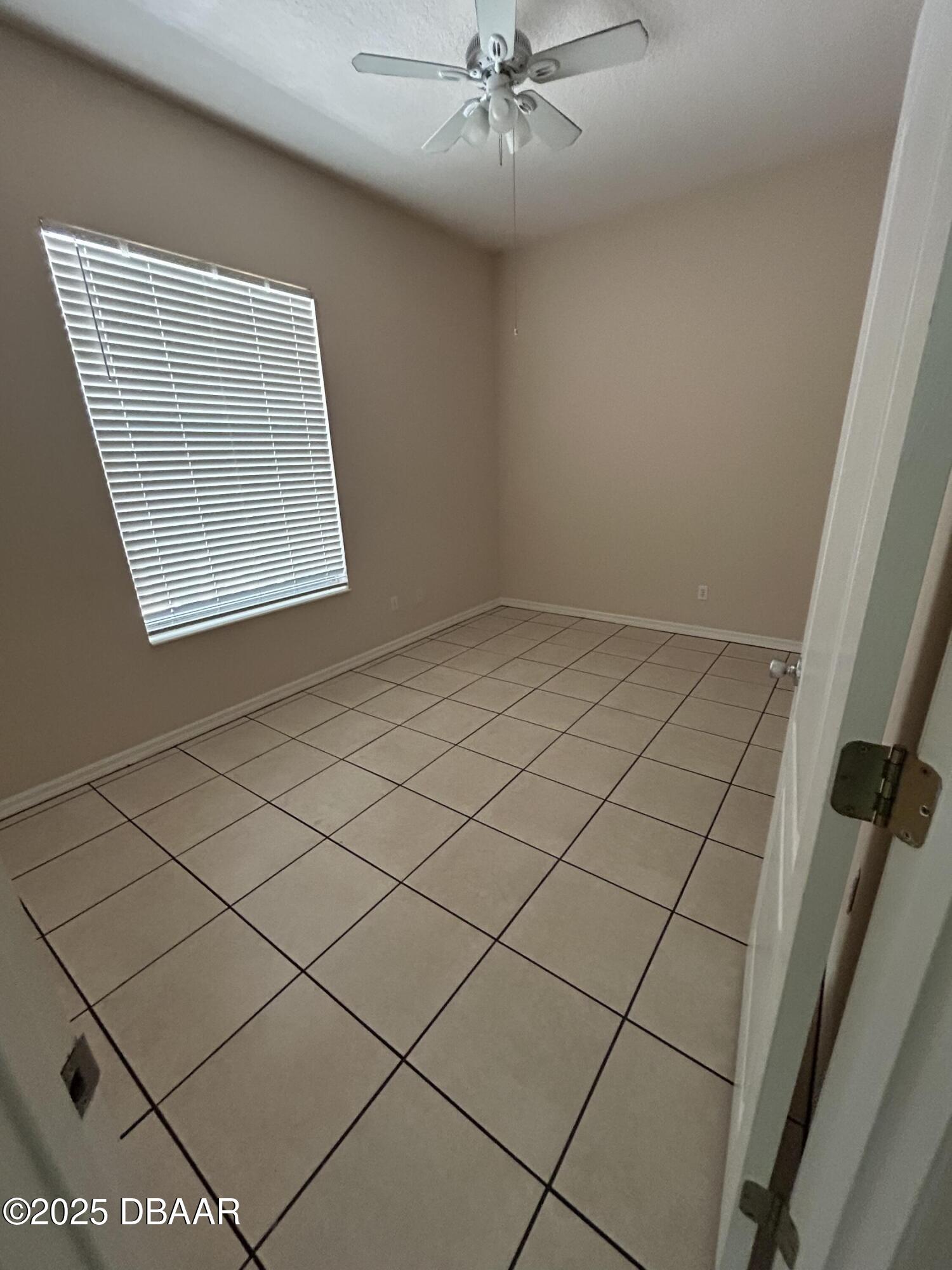 90 Buschman Drive Ponce Inlet, FL 32127 - Photo 32 of 37 a view of an empty room and window