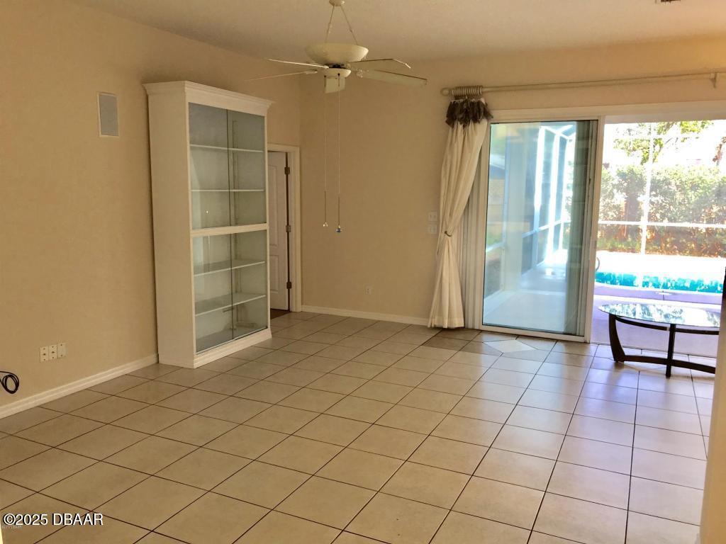 90 Buschman Drive Ponce Inlet, FL 32127 - Photo 9 of 37 an empty room with windows and painted walls