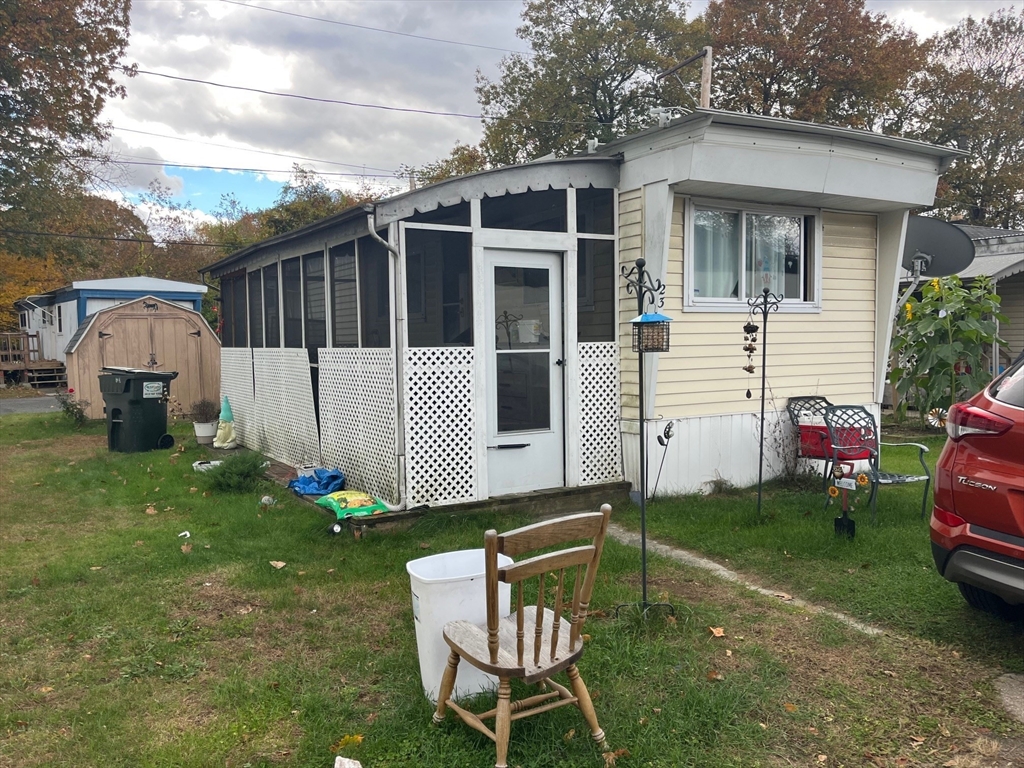 189 Springfield Road, Unit 23 Westfield, MA 01085 - Photo 3 of 14 a front view of a house with garden
