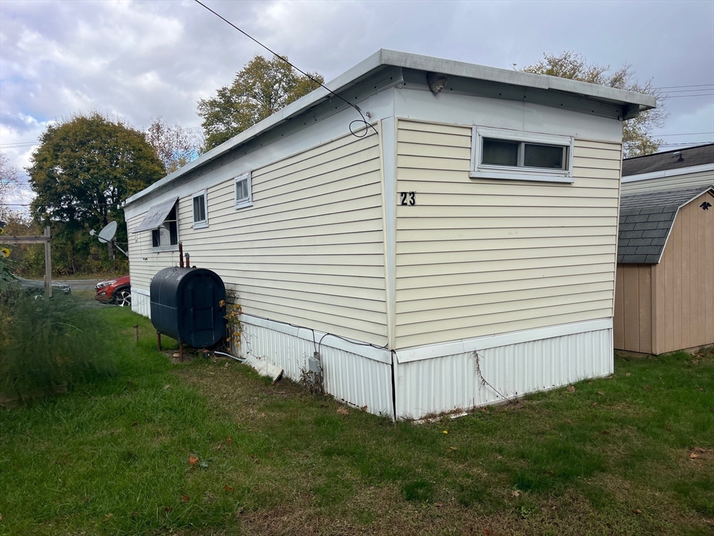 189 Springfield Road, Unit 23 Westfield, MA 01085 - Photo 6 of 14 a view of a house with a backyard