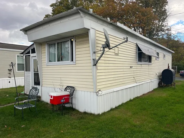 a view of a house with a backyard