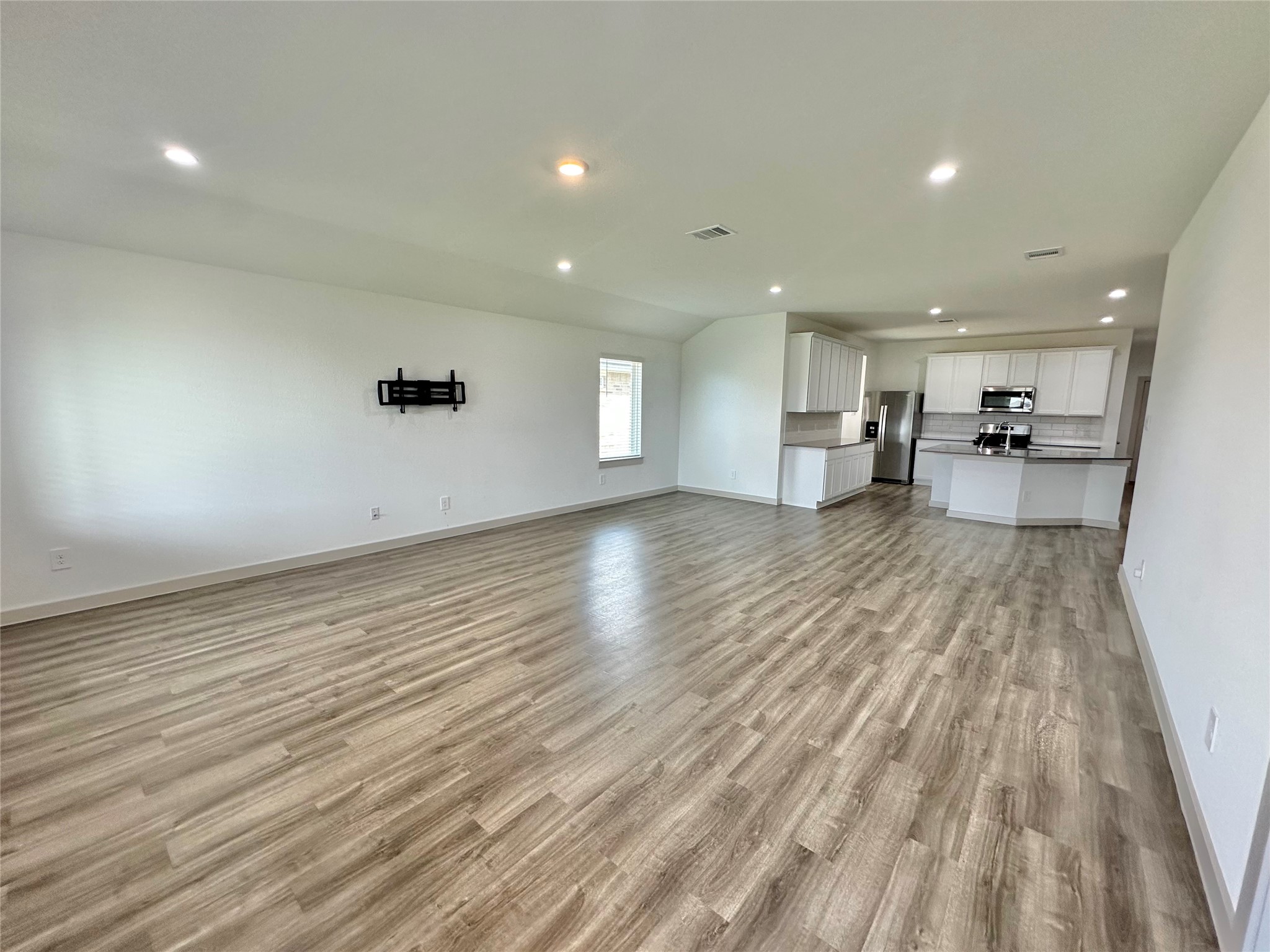 1107 Curly Angora Court Rosharon, TX 77583 - Photo 26 of 42 a view of a kitchen with wooden floor and a sink