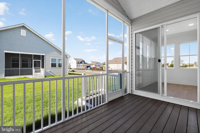 a view of a balcony with floor to ceiling window wooden floor