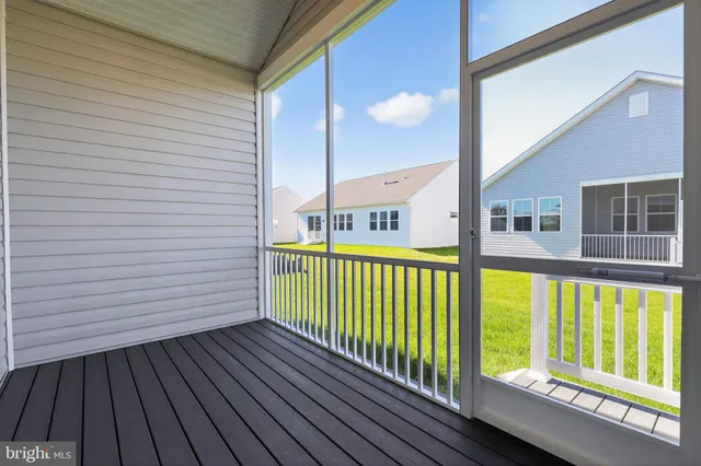 a view of a balcony with furniture