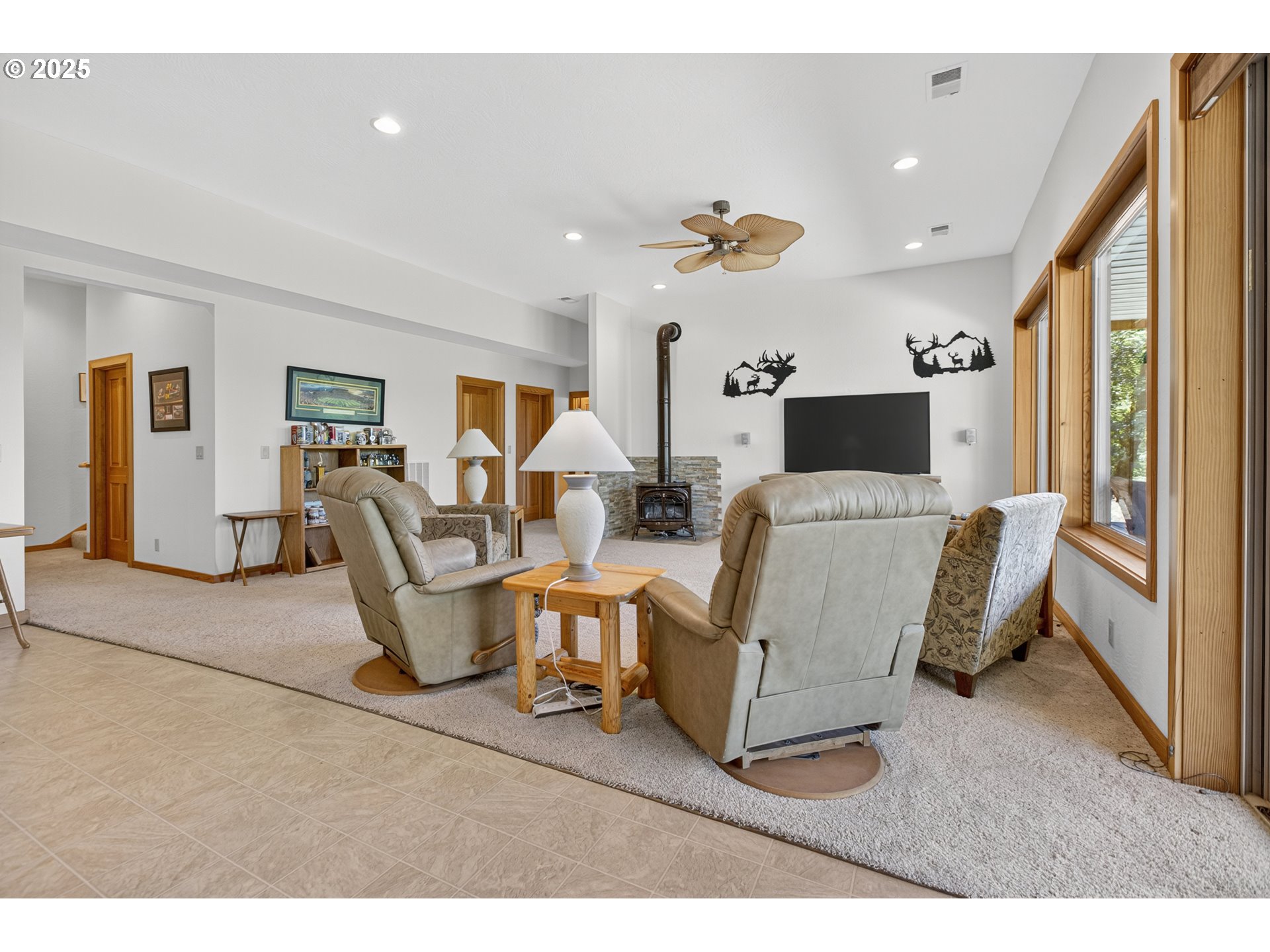 89112 Sky High Drive Springfield, OR 97478 - Photo 26 of 47 a living room with couches and kitchen view with wooden floor