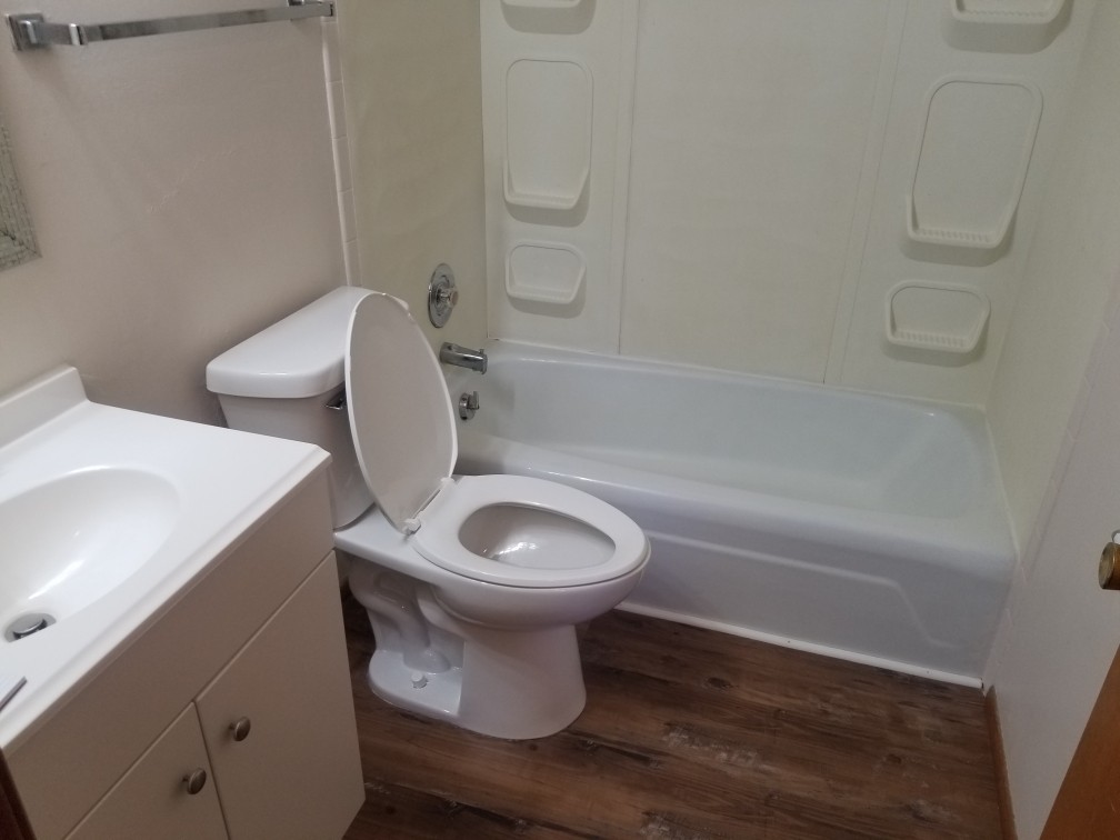 1320 Maple Drive, Unit 8 Peru, IL 61354 - Photo 5 of 5 a bathroom with a toilet a sink and bathtub