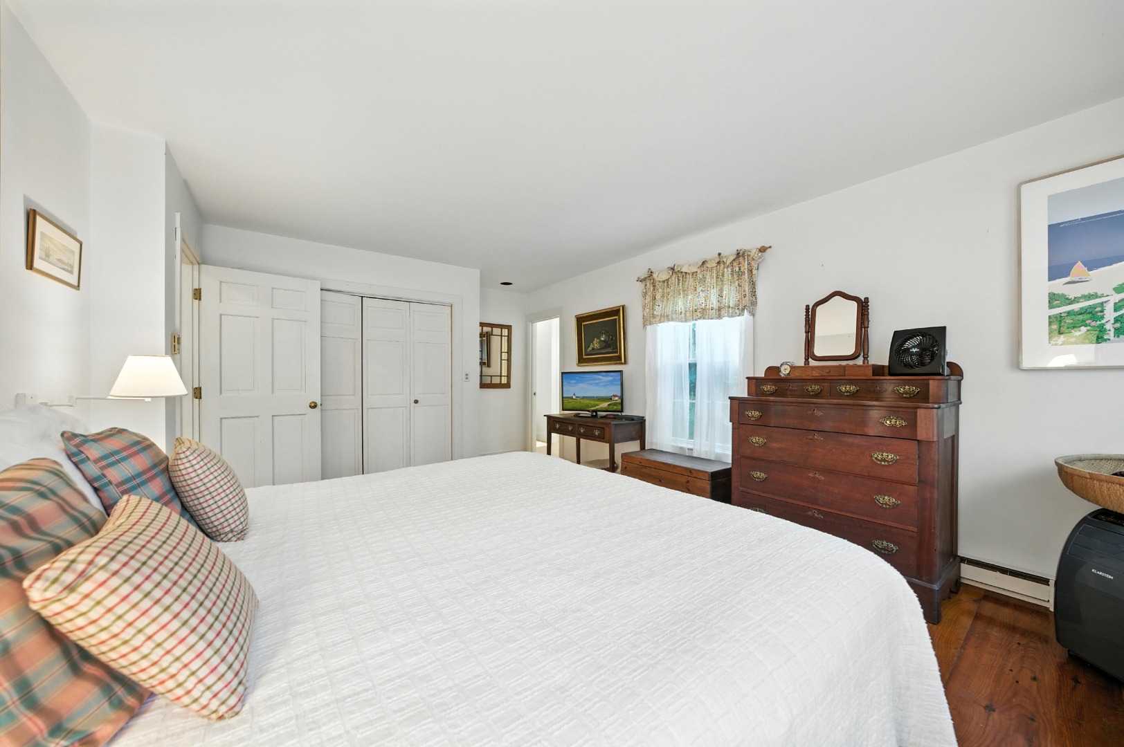 10 Meadow View Drive Nantucket, MA 02554 - Photo 24 of 48 a bedroom with a bed and a dresser