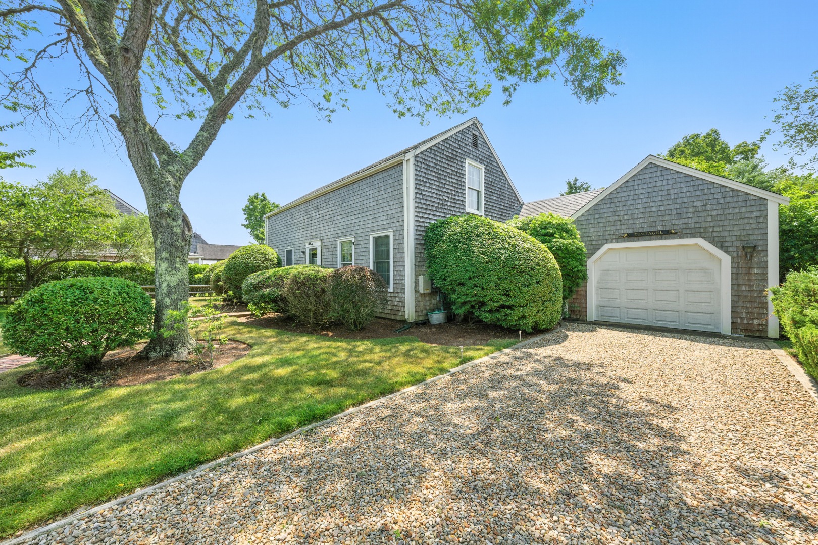 10 Meadow View Drive Nantucket, MA 02554 - Photo 5 of 48 a front view of a house with garden