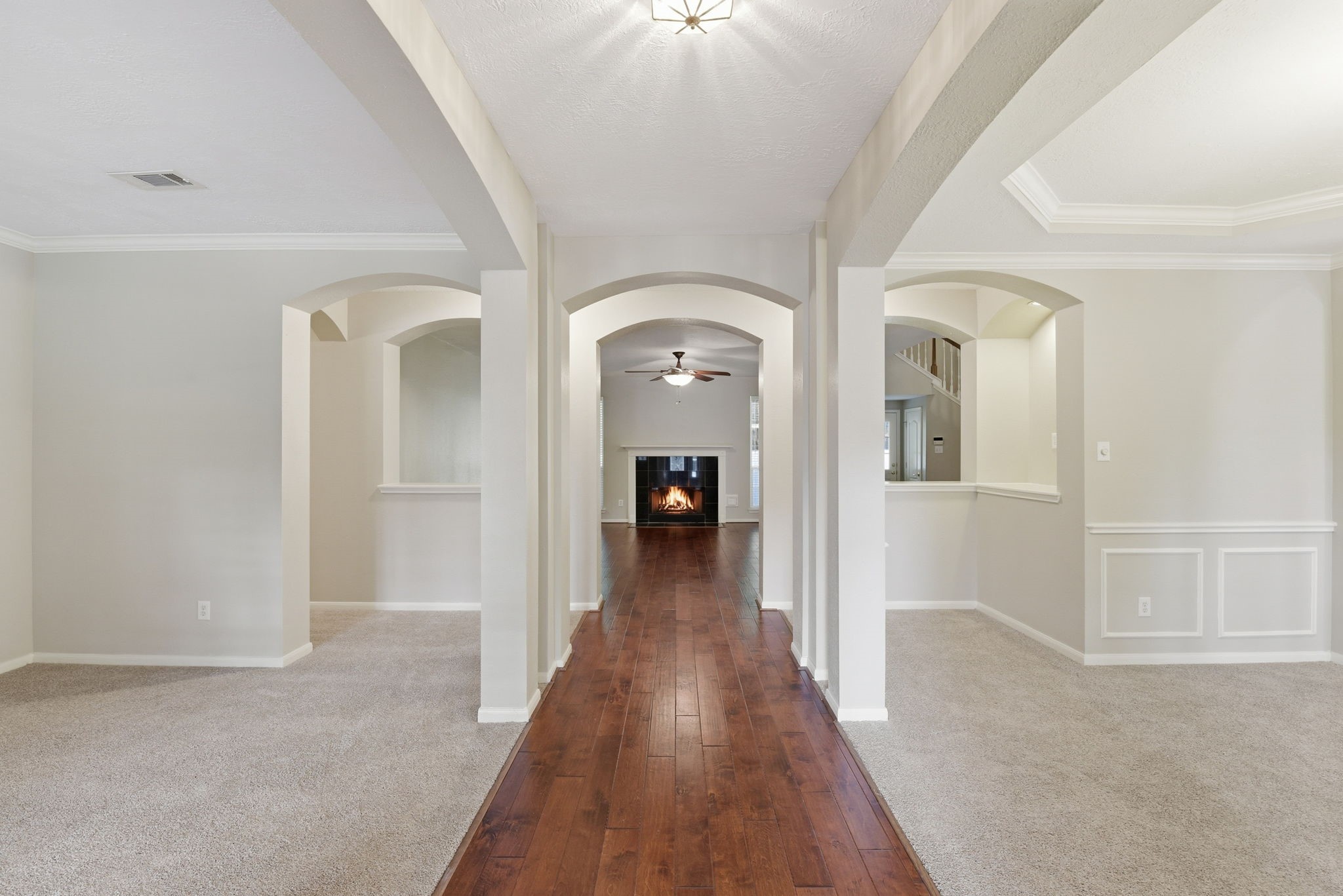3414 Hackberry Court Spring, TX 77388 - Photo 5 of 50 As you enter the formal dining is to your right and the formal living (or home office or flex space) is to your left Lovely wood floors in the entry and on into the family room. Carpet replaced in April 2026, fresh paint.