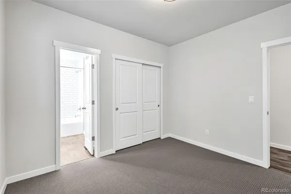 an empty room with closet area