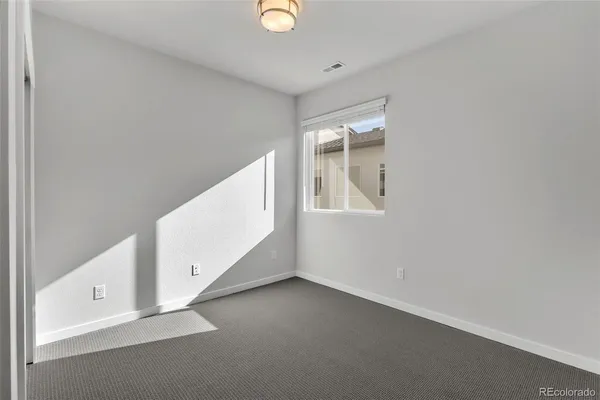 an entryway in a hall with a window