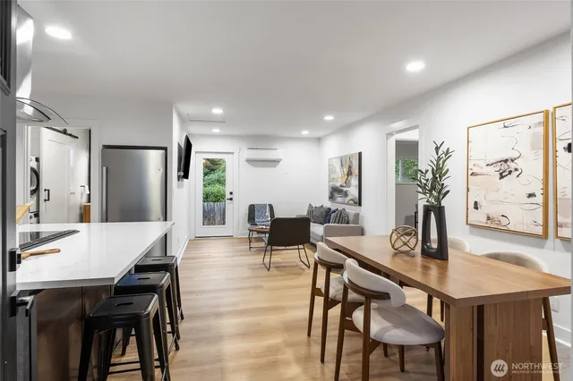 a dining room with furniture and window