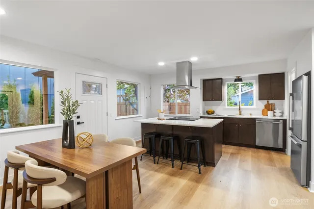 a kitchen with a table and chairs in it