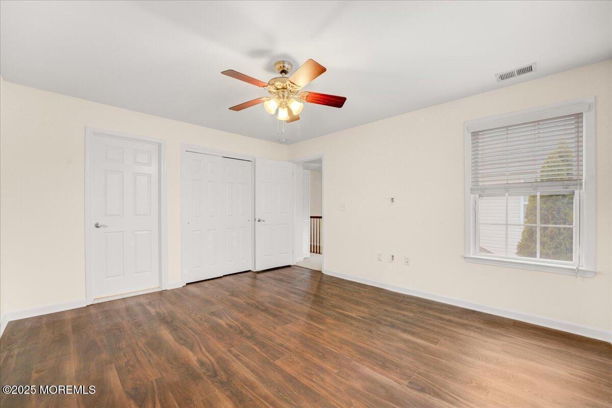 28 Santa Rosa Lane Tinton Falls, NJ 07753 - Photo 14 of 26 wooden floor in an empty room with a window