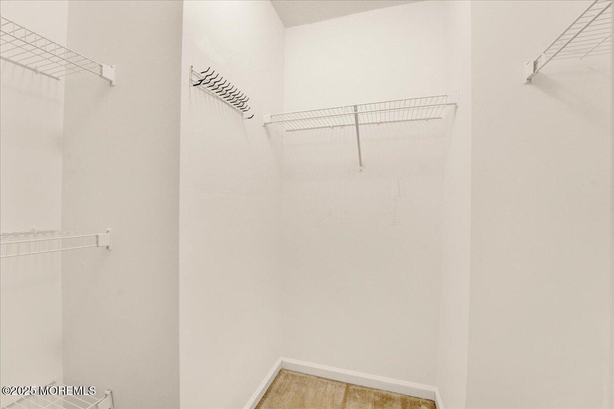 28 Santa Rosa Lane Tinton Falls, NJ 07753 - Photo 21 of 26 a view of small space with racks on the wall
