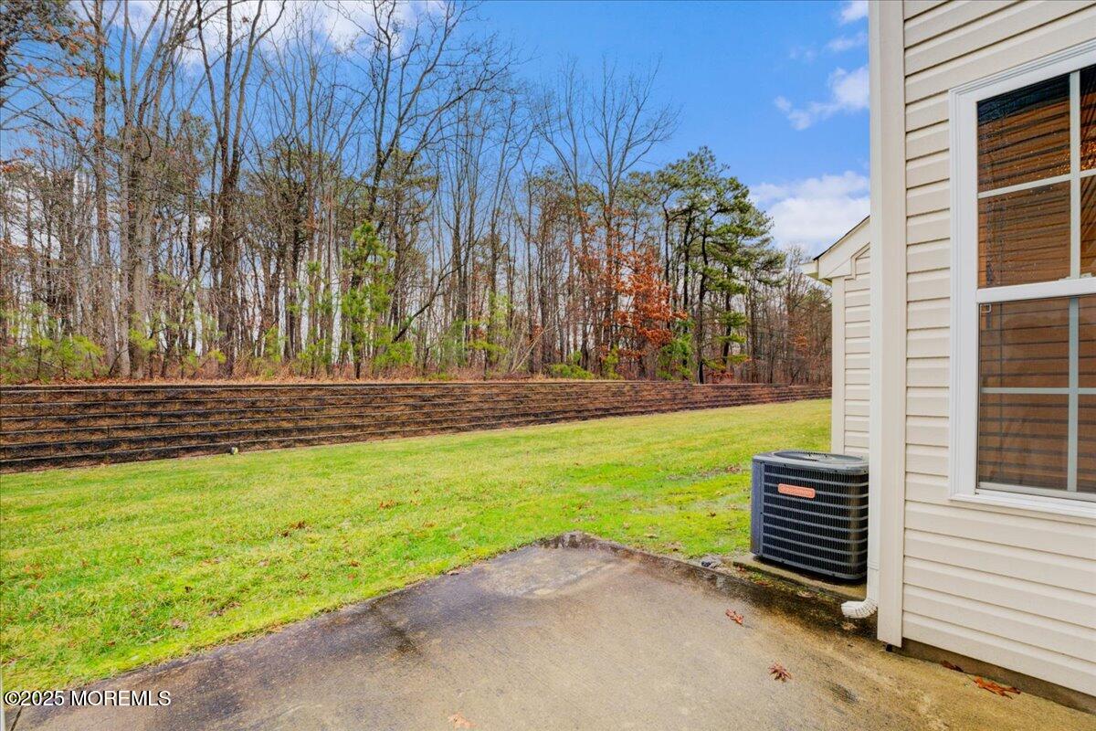 28 Santa Rosa Lane Tinton Falls, NJ 07753 - Photo 25 of 26 a view of a backyard with large trees