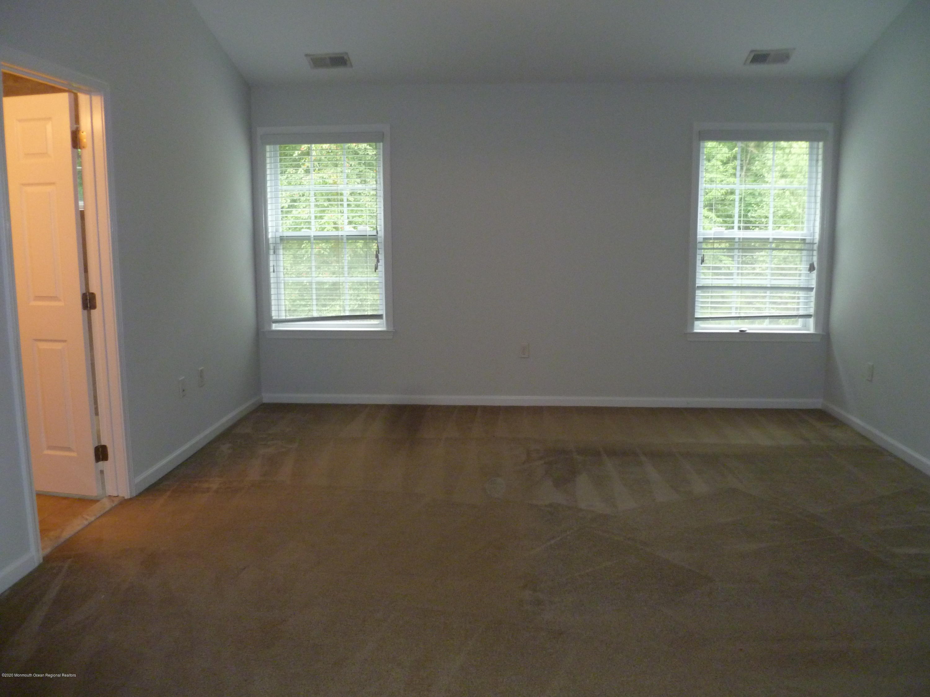 28 Santa Rosa Lane Tinton Falls, NJ 07753 - Photo 9 of 12 an empty room with a window