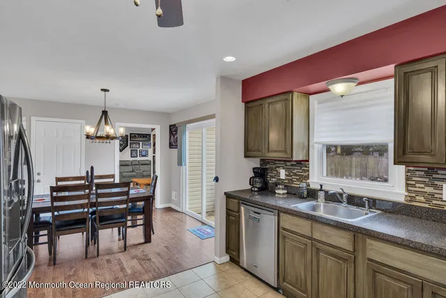 a kitchen with sink and window