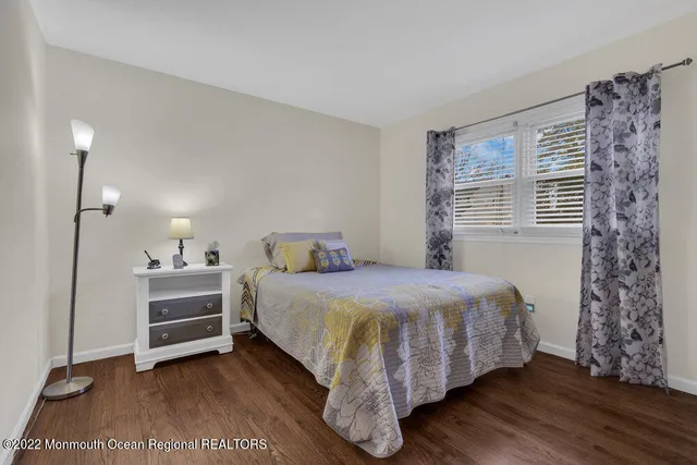 a view of a backyard with a garden and deck