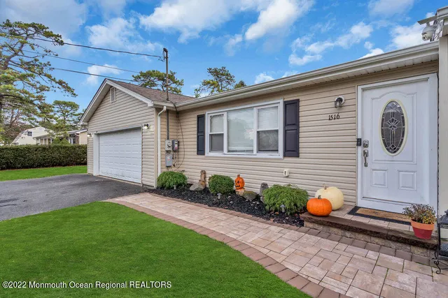 a backyard of a house with seating space