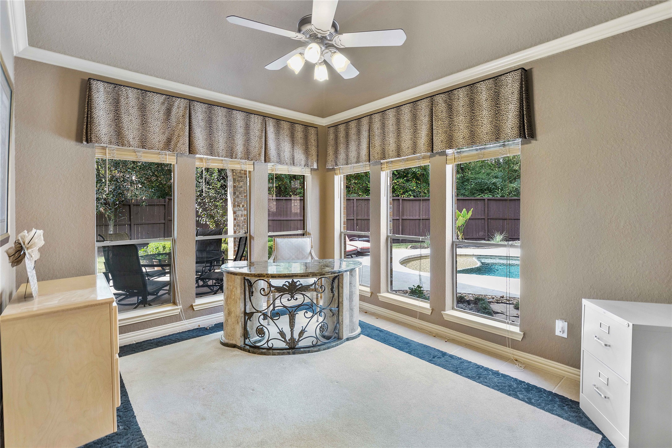 7 North Spring Brook Court Spring, TX 77382 - Photo 11 of 49 The oversized home office/study has a beautiful view of the pool and built-in shelving. Perfect for the work from home setup!