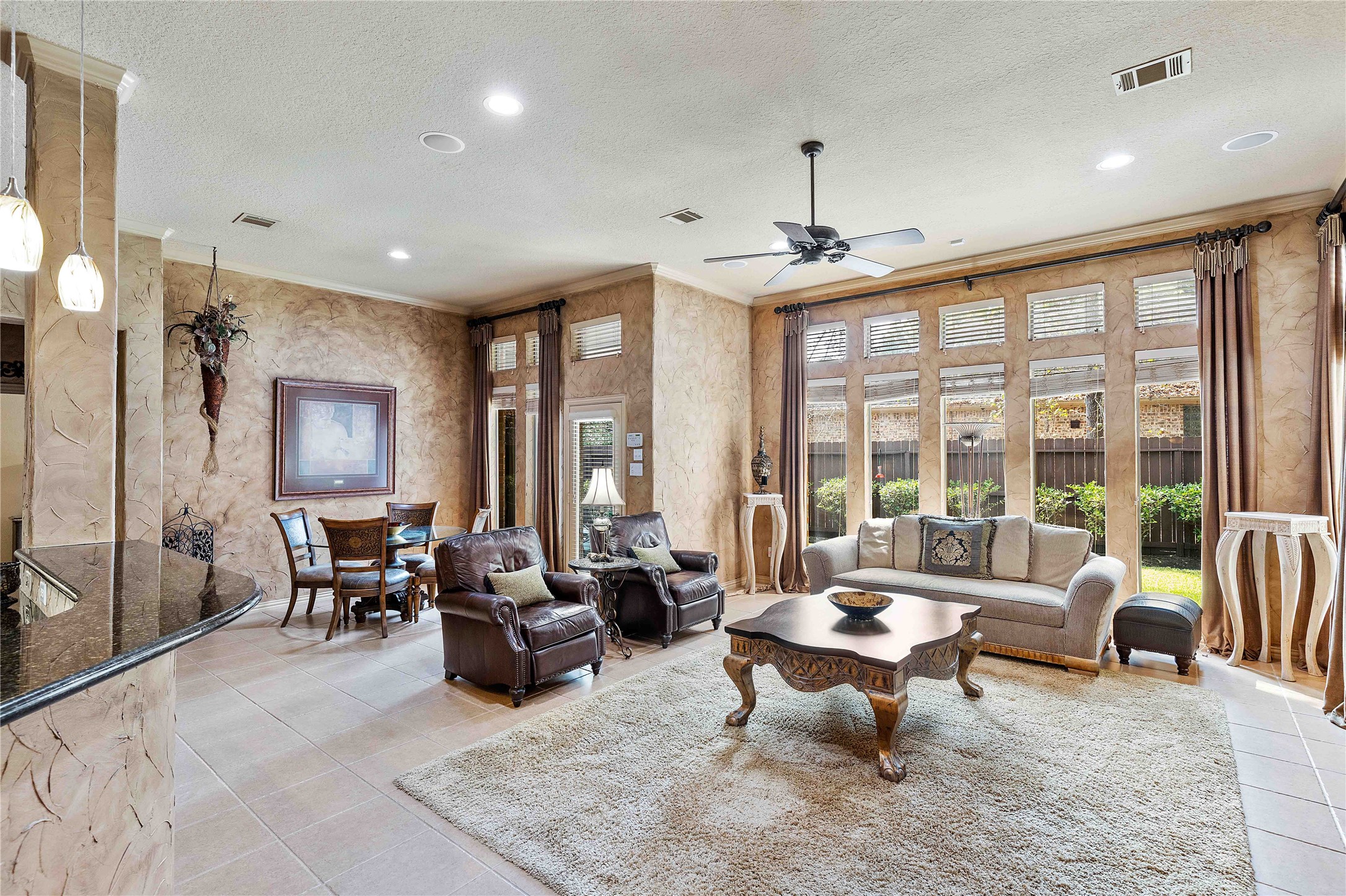 7 North Spring Brook Court Spring, TX 77382 - Photo 16 of 49 Enjoy your coffee while the natural light beams in through the floor to ceiling windows!