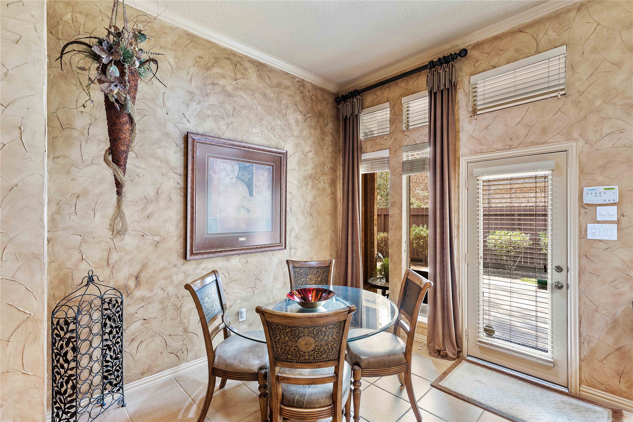 7 North Spring Brook Court Spring, TX 77382 - Photo 18 of 49 Backyard patio access is central to the house, right next to the breakfast room. The pool features can also be controlled from inside near the back door.
