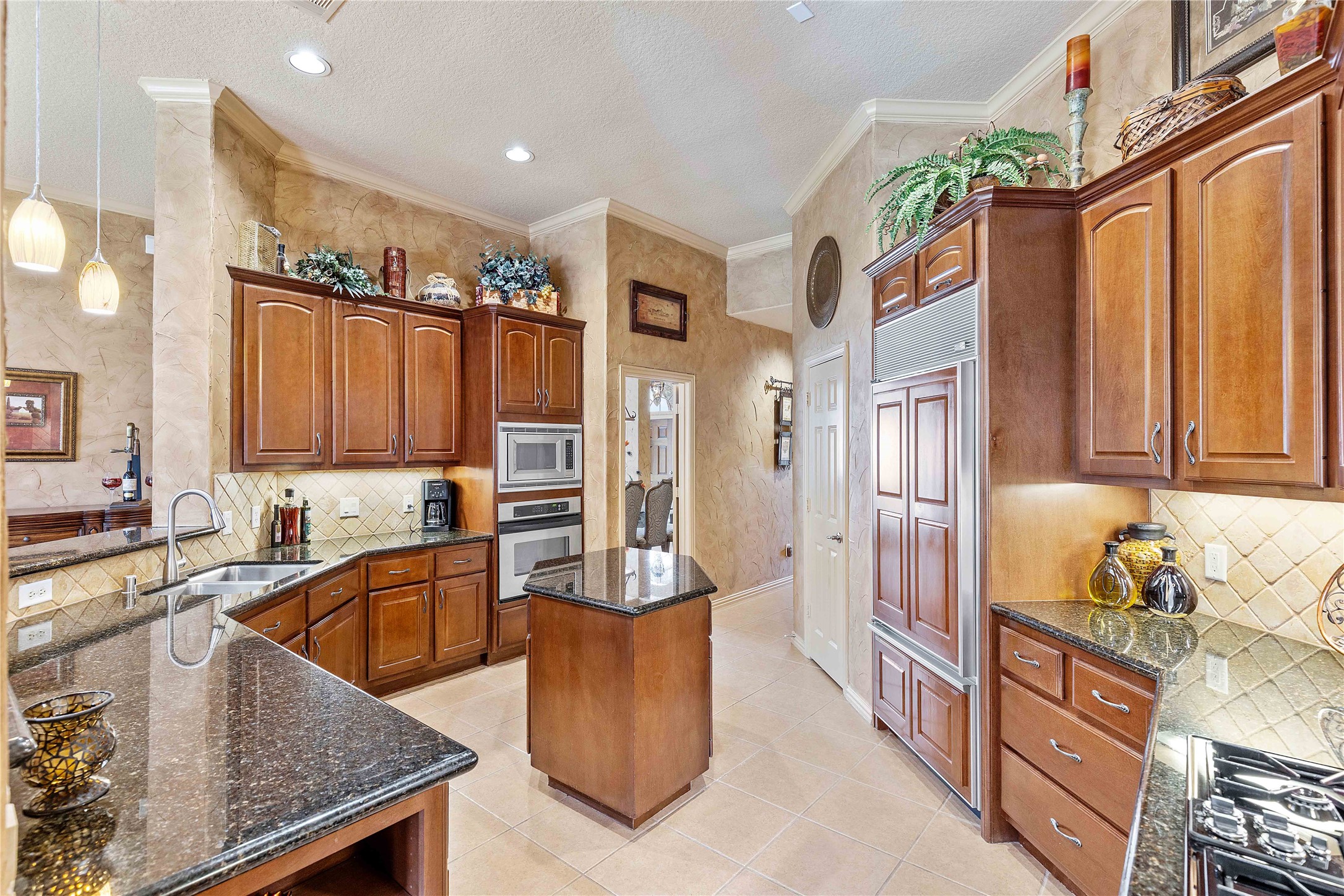 7 North Spring Brook Court Spring, TX 77382 - Photo 20 of 49 Enjoy the sub zero refrigerator, extra storage, and the tall bar - perfect for hosting!