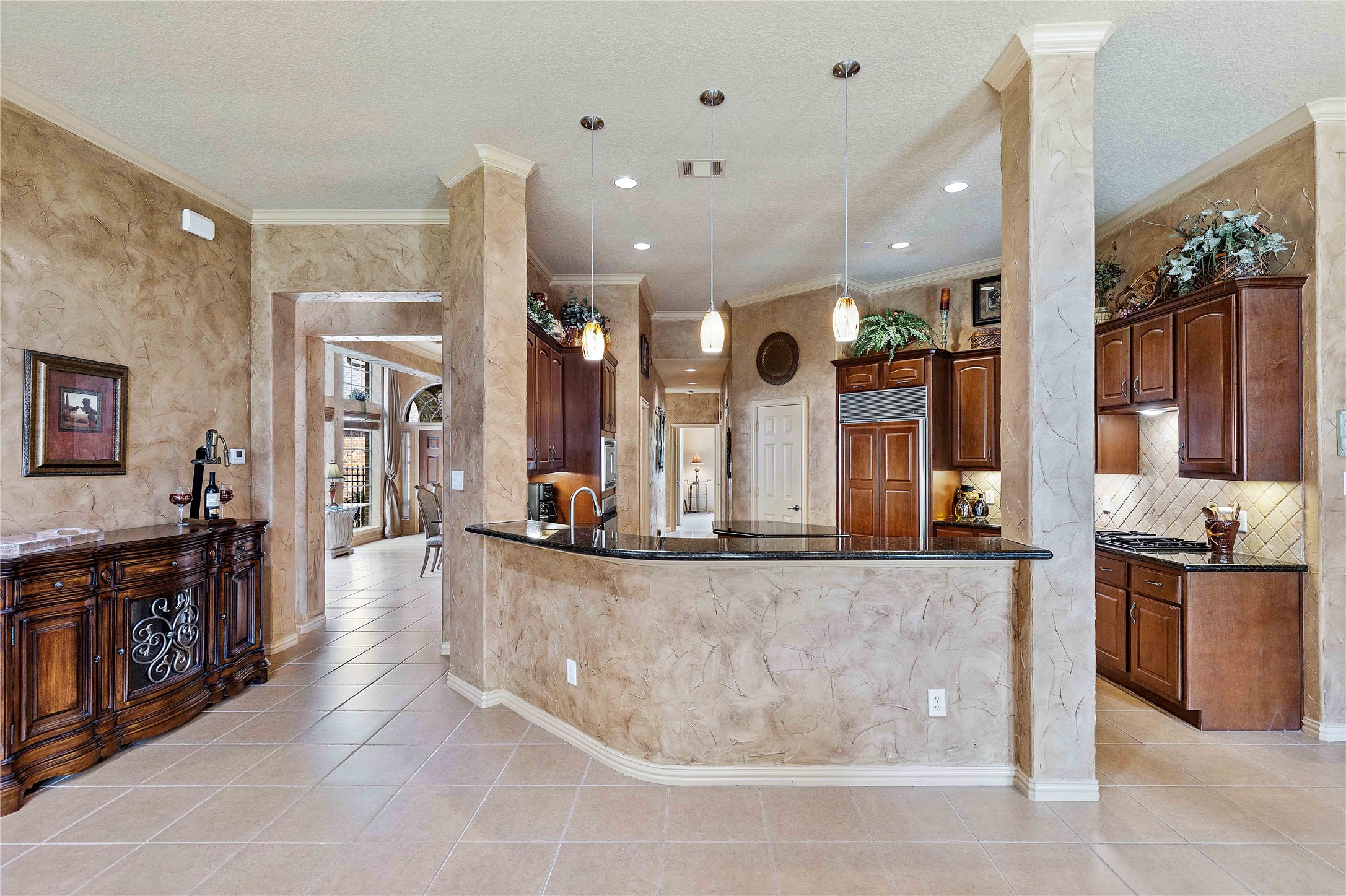 7 North Spring Brook Court Spring, TX 77382 - Photo 23 of 49 There is more than enough room for bar stools off the kitchen, giving ample seating choices for guests and family.