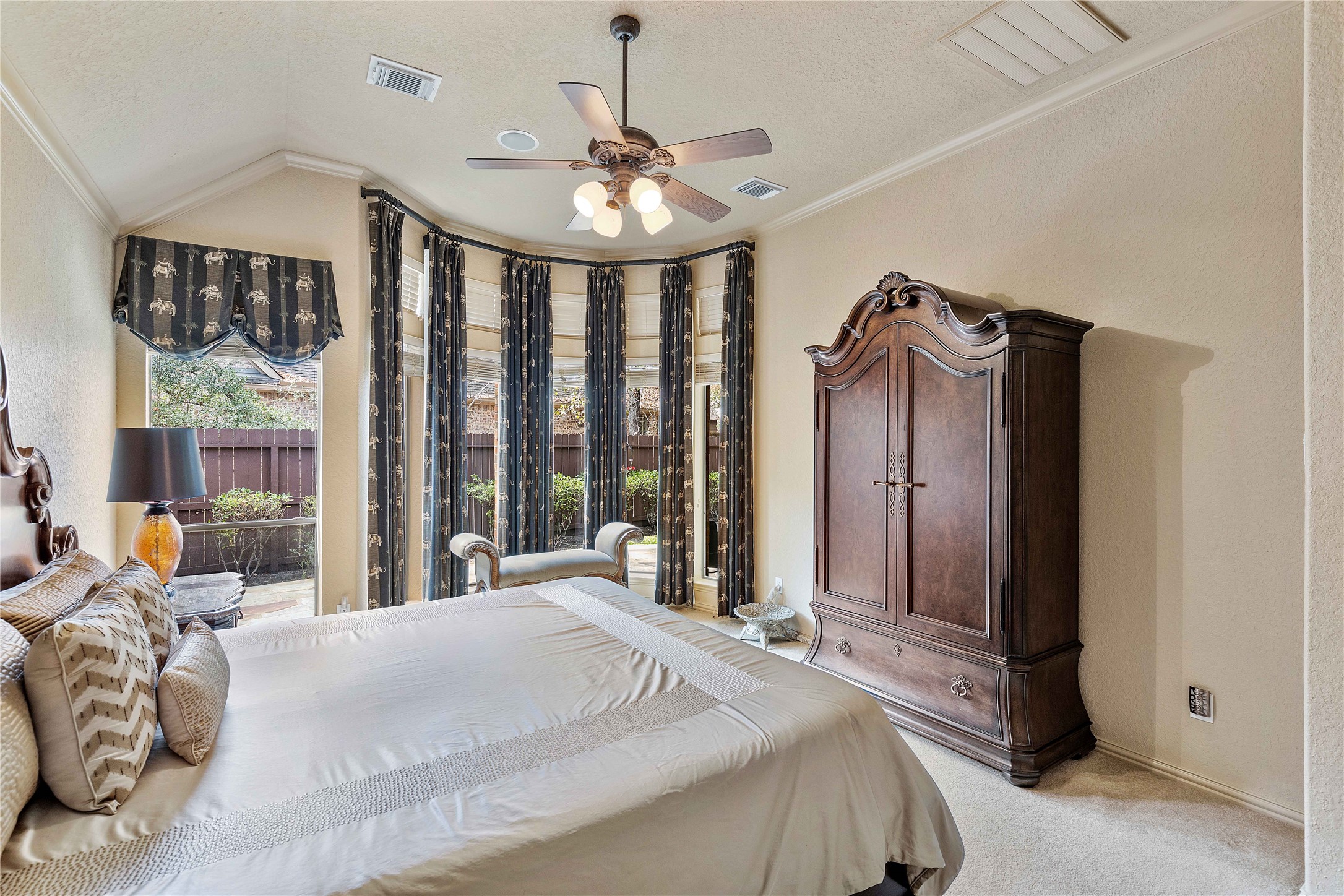 7 North Spring Brook Court Spring, TX 77382 - Photo 25 of 49 Enjoy your primary retreat with floor to ceiling windows and plenty of room for seating and sleeping.