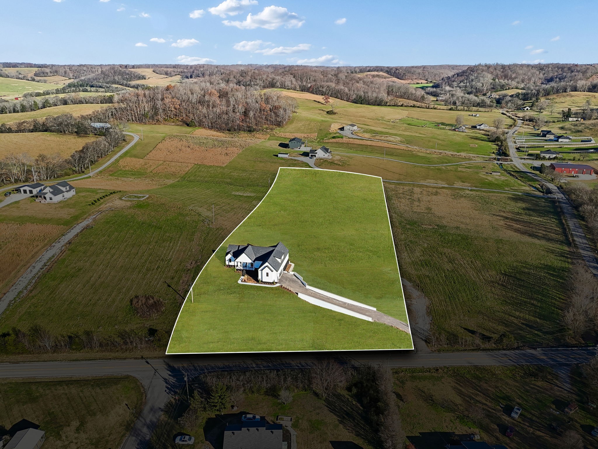 a view of a lake with a yard
