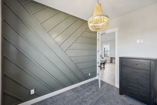 a bed room with a bed and a window