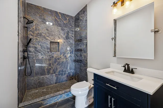 a view of a room with wooden walls