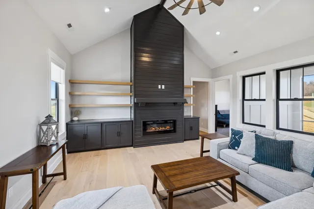a living room with furniture and a large window
