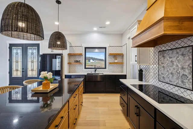 a kitchen with a sink and a refrigerator