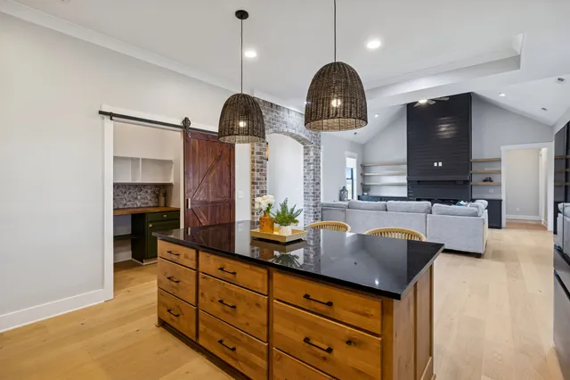 a view of a livingroom with an empty space and a window