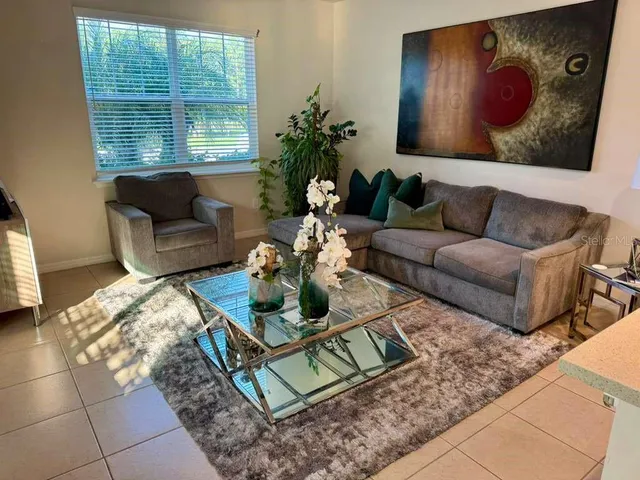 a living room with furniture and a window