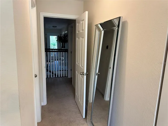 a view of building with river and trees in the background