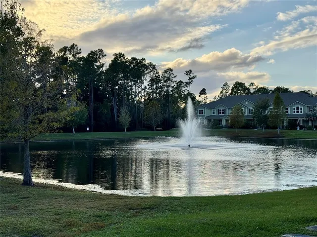 a view of a lake with a big yard