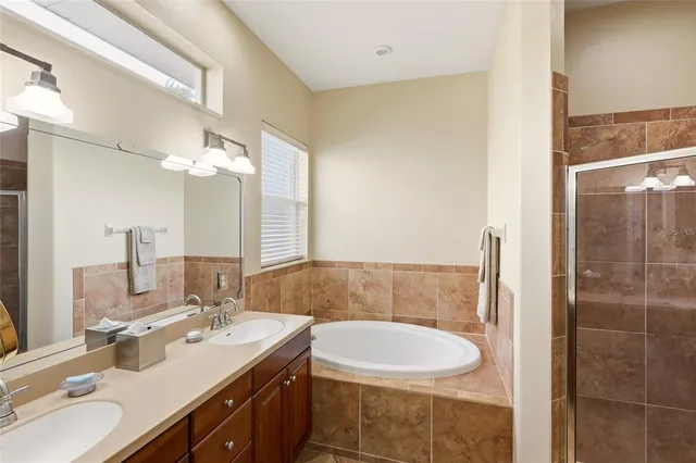 a bathroom with a double vanity sink mirror and double