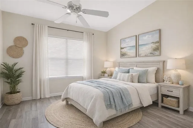 a bedroom with a large bed and a window