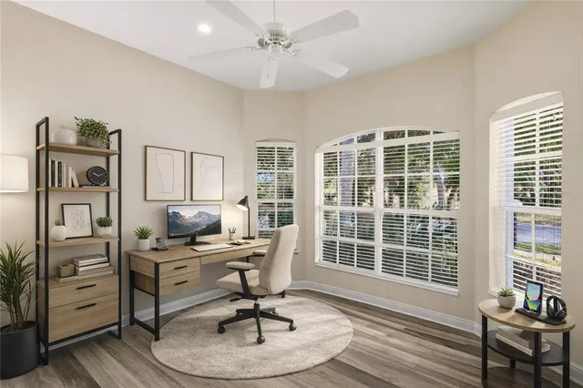 a workspace with furniture hardwood and windows